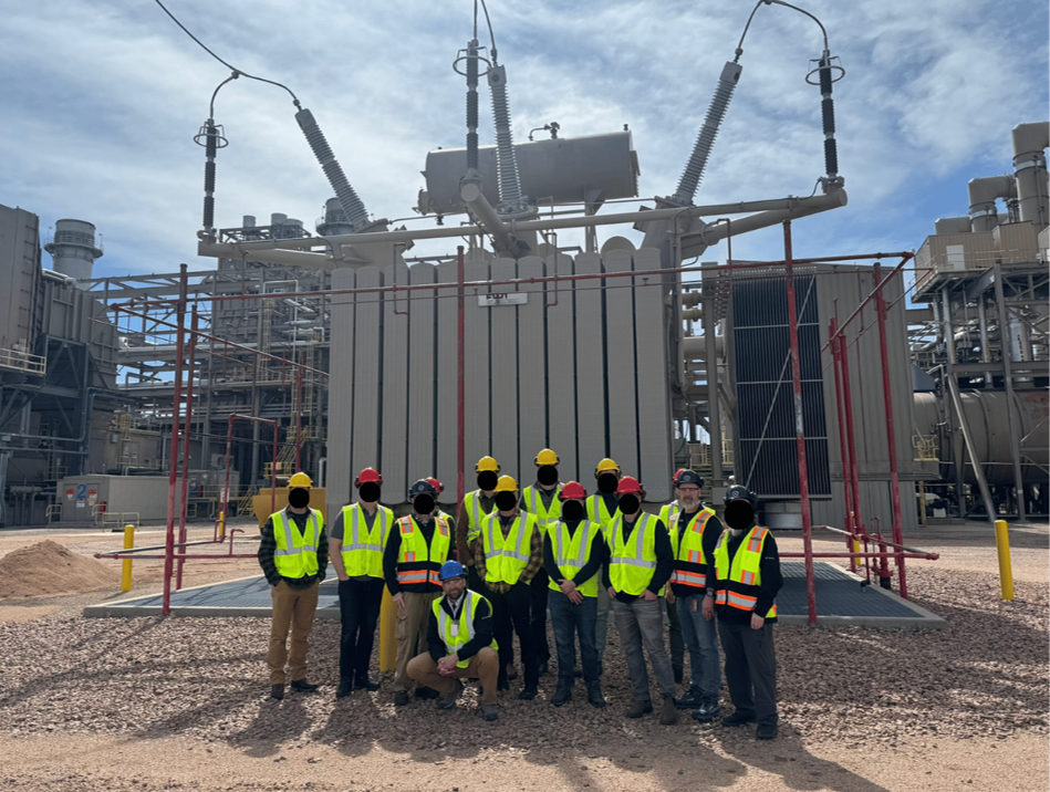 GRANITE DAGGER course participants conduct a site visit at a power generation facility, examining a high-voltage transformer as part of critical infrastructure training.